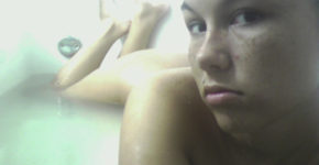 Naked freckled teen in bathtub